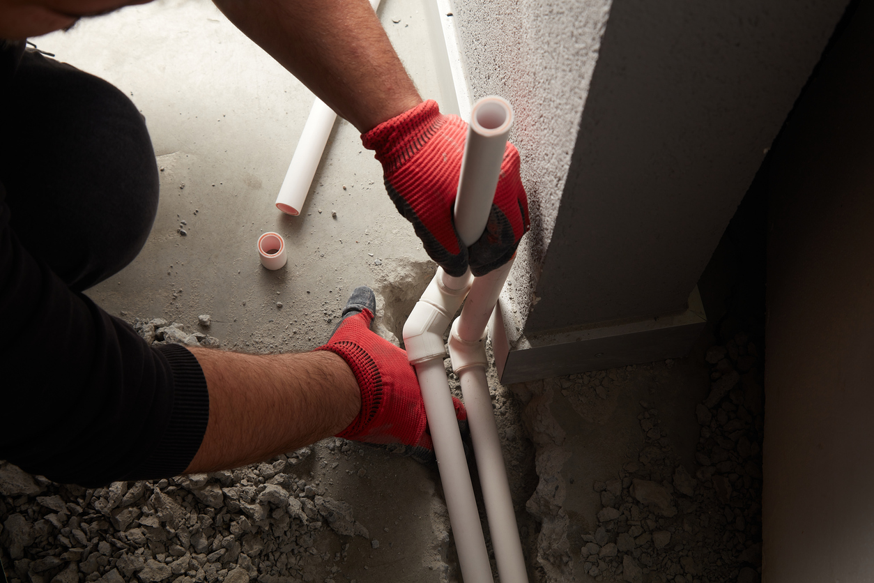 Plumber Installing Pipes